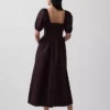 Robe longue corset à manches bouffantes