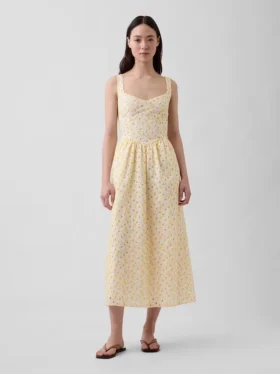 Robe longue à taille basse et coutures ajourées