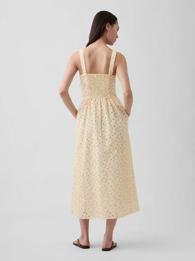 Robe longue à taille basse et coutures ajourées