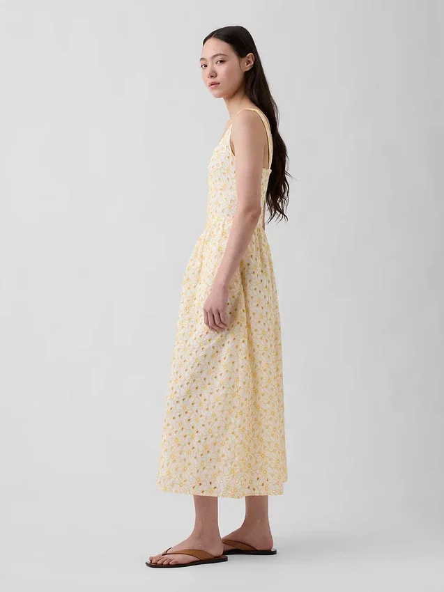 Robe longue à taille basse et coutures ajourées