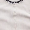 T-shirt moderne à col rond et boutons sur le devant