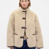 Veste en sherpa recyclé avec finitions en cuir vegan