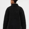 Veste en sherpa recyclé avec finitions en cuir vegan