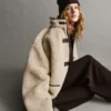 Veste en sherpa recyclé avec finitions en cuir vegan